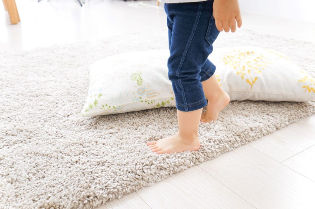 child on clean carpet
